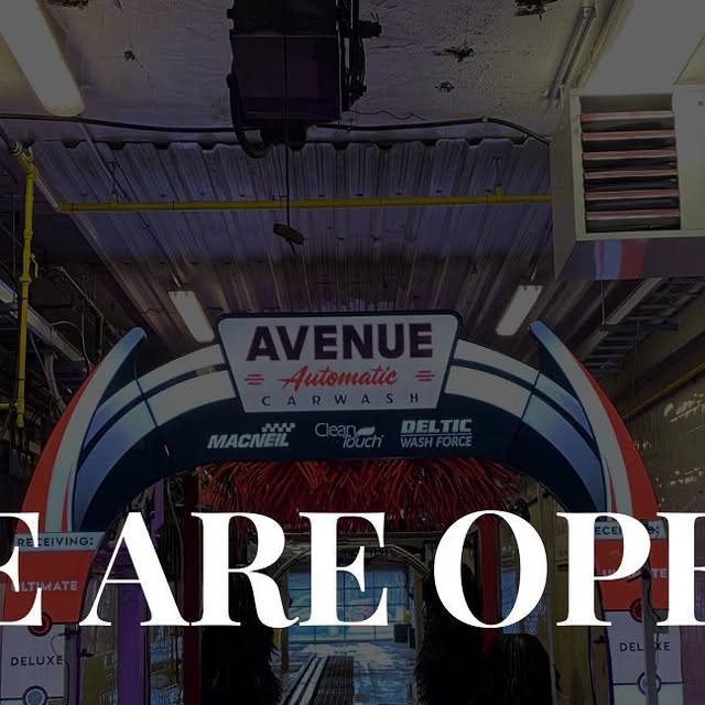 Avenue Automatic Car Wash interior tunnel entrance with branded arch and equipment logos